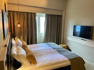 Фото номера Стандартный двухместный номер с 1 кроватью Отель Skyline Airport Hotel г. Вантаа 7